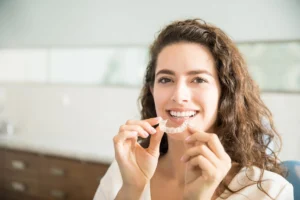 Patient holding a clear aligner case