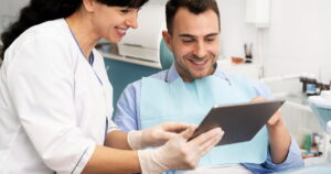 Dentist doing a check up on the patient to check for CDCP eligibility for Dental Crowns