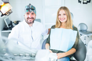 A smiling patient with a dentist at a dental clinic in North York