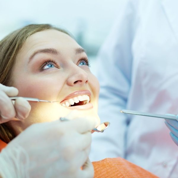 Orthodontist checking a patient's smile